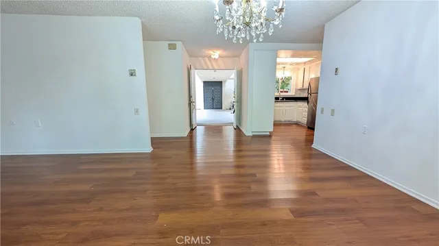 a kitchen with a sink a refrigerator and a stove