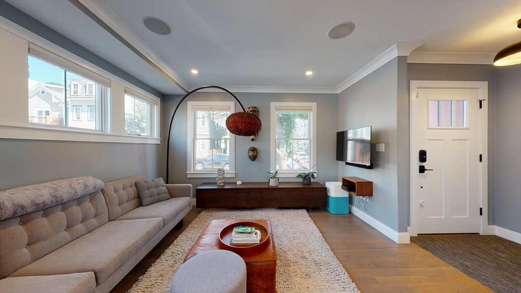 459 East 8th Street, Unit 1 Boston, MA 02127 - Photo 12 of 31 a living room with furniture and a large window