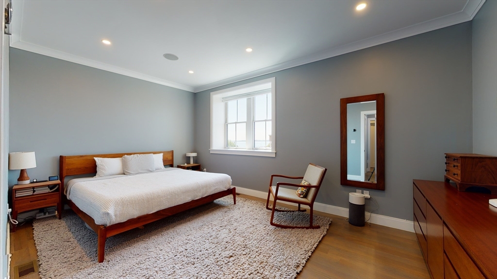 459 East 8th Street, Unit 1 Boston, MA 02127 - Photo 14 of 31 a bedroom with a bed and a couch