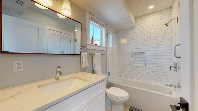 a bathroom with a sink a toilet and a bathtub
