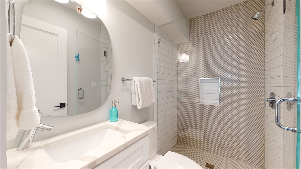 459 East 8th Street, Unit 1 Boston, MA 02127 - Photo 23 of 31 a bathroom with a sink a toilet and shower