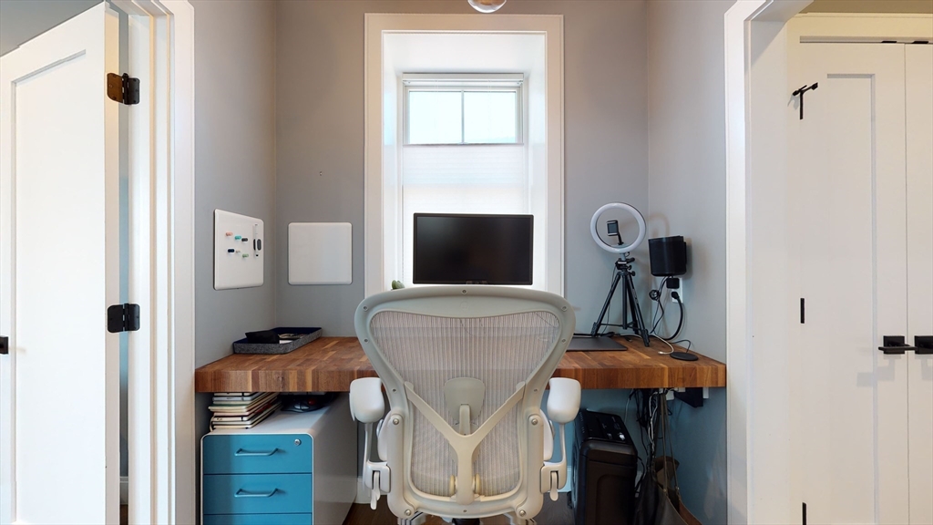 459 East 8th Street, Unit 1 Boston, MA 02127 - Photo 24 of 31 a living room with furniture and a flat screen tv