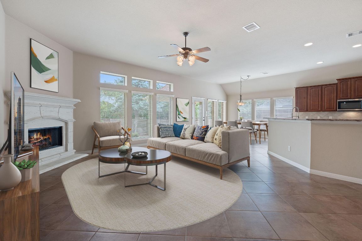 1809 Cross Draw Trail Leander, TX 78641 - Photo 2 of 22 a living room with furniture and a fireplace