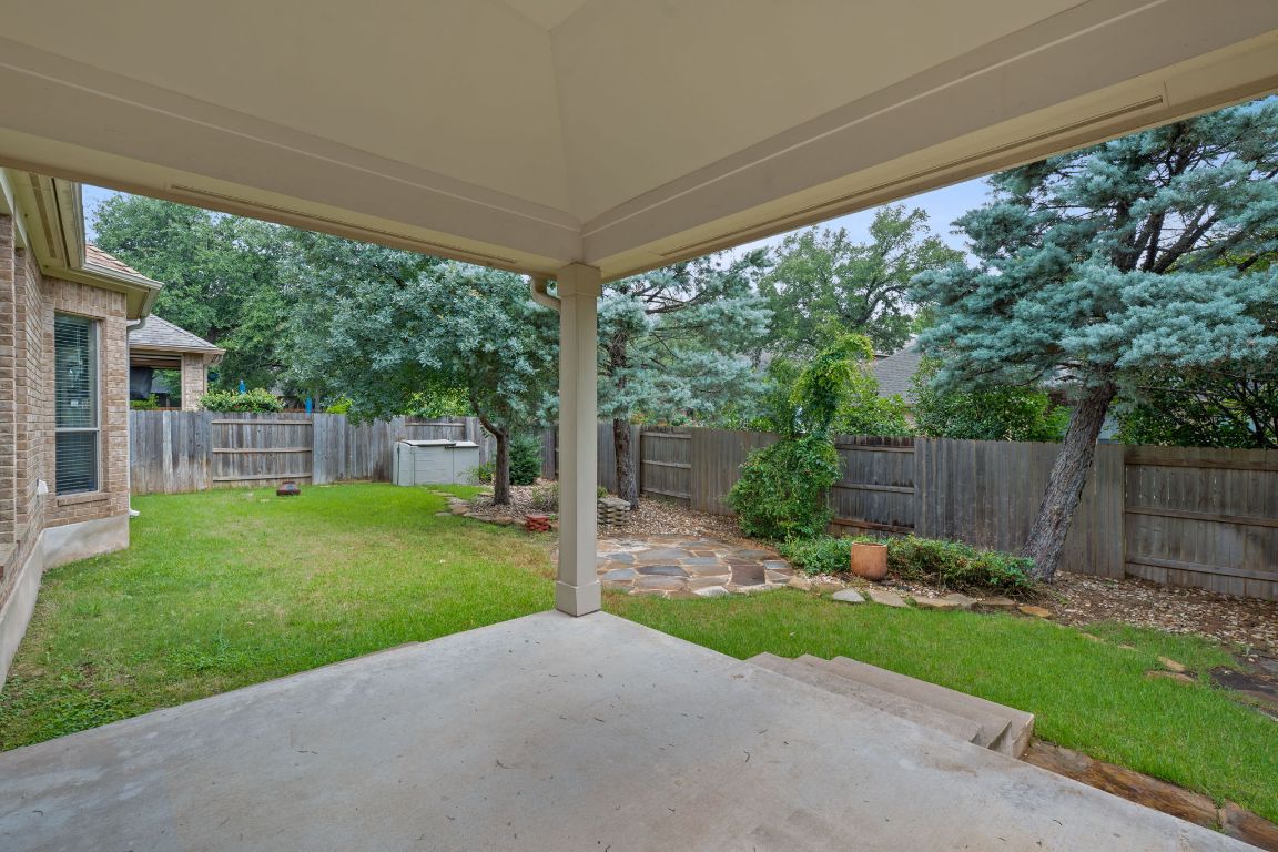 1809 Cross Draw Trail Leander, TX 78641 - Photo 21 of 22 a view of a backyard with plants and a garden