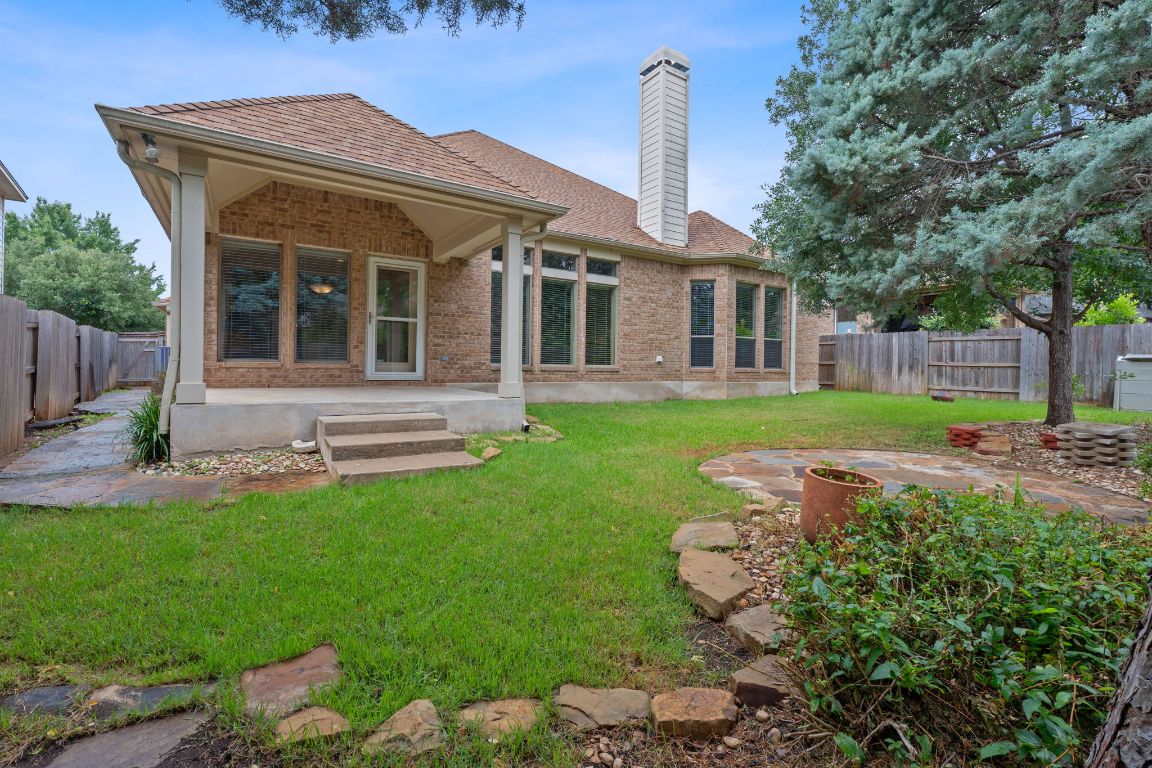 1809 Cross Draw Trail Leander, TX 78641 - Photo 22 of 22 a front view of a house with a yard and porch