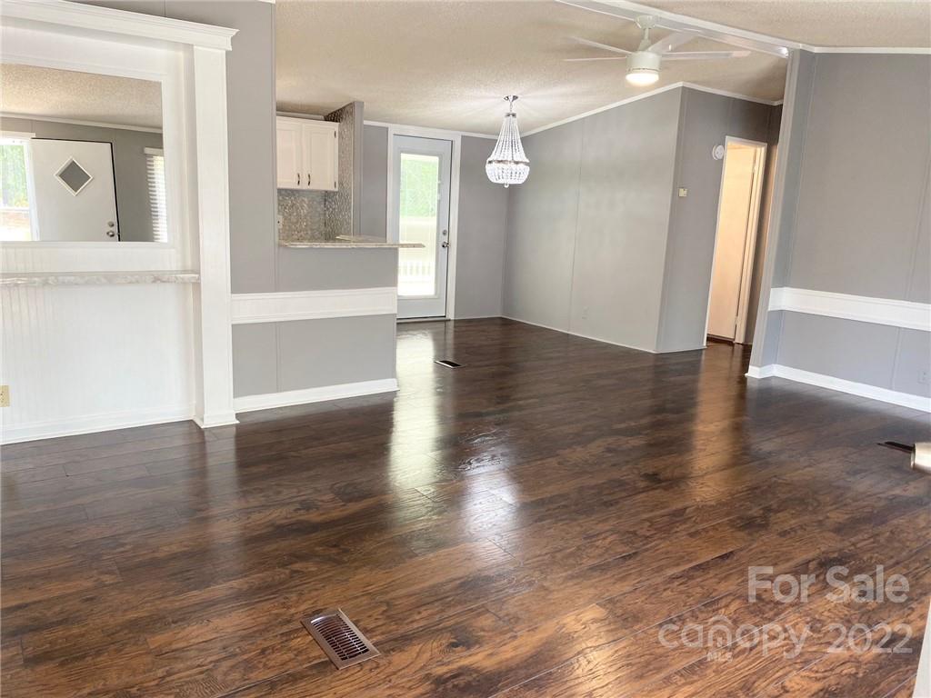 3283 Rhyner Road Lancaster, SC 29720 - Photo 14 of 35 a view of empty room with wooden floor and fan