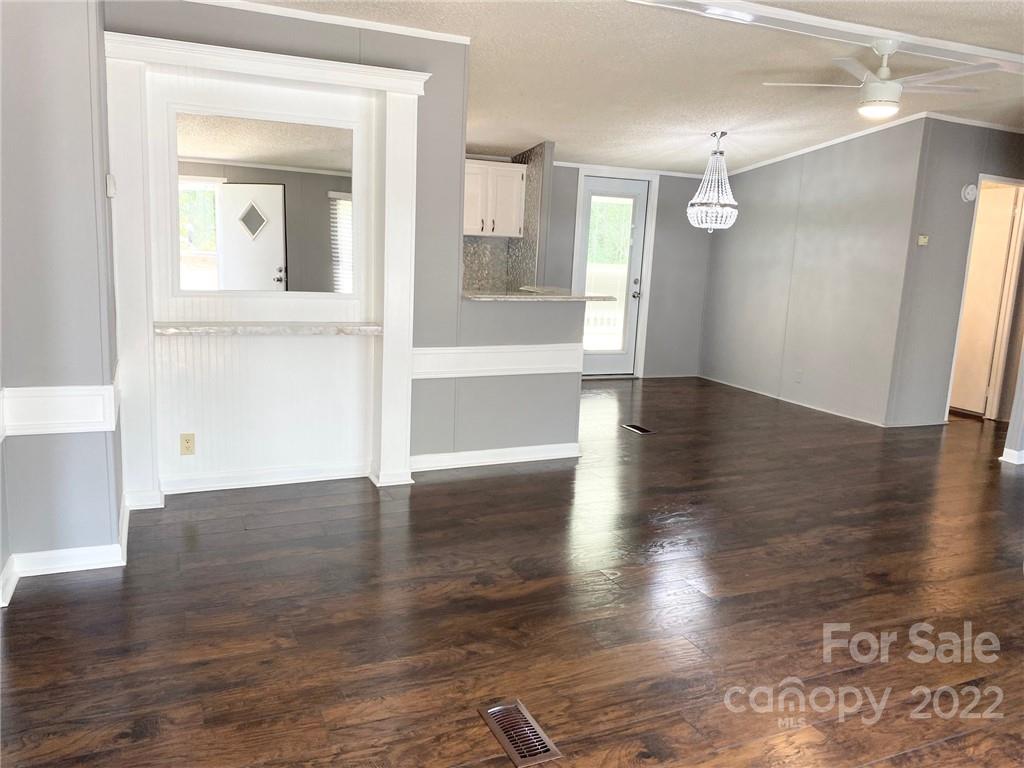 3283 Rhyner Road Lancaster, SC 29720 - Photo 15 of 35 wooden floor in an empty room with a window