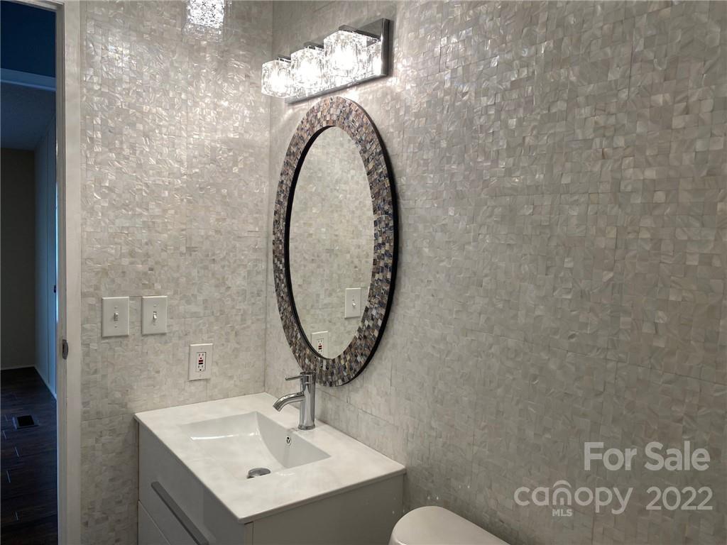 3283 Rhyner Road Lancaster, SC 29720 - Photo 19 of 35 a bathroom with a sink and a mirror