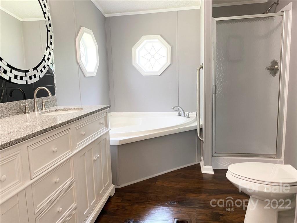 3283 Rhyner Road Lancaster, SC 29720 - Photo 23 of 35 a bathroom with a toilet a sink and a mirror
