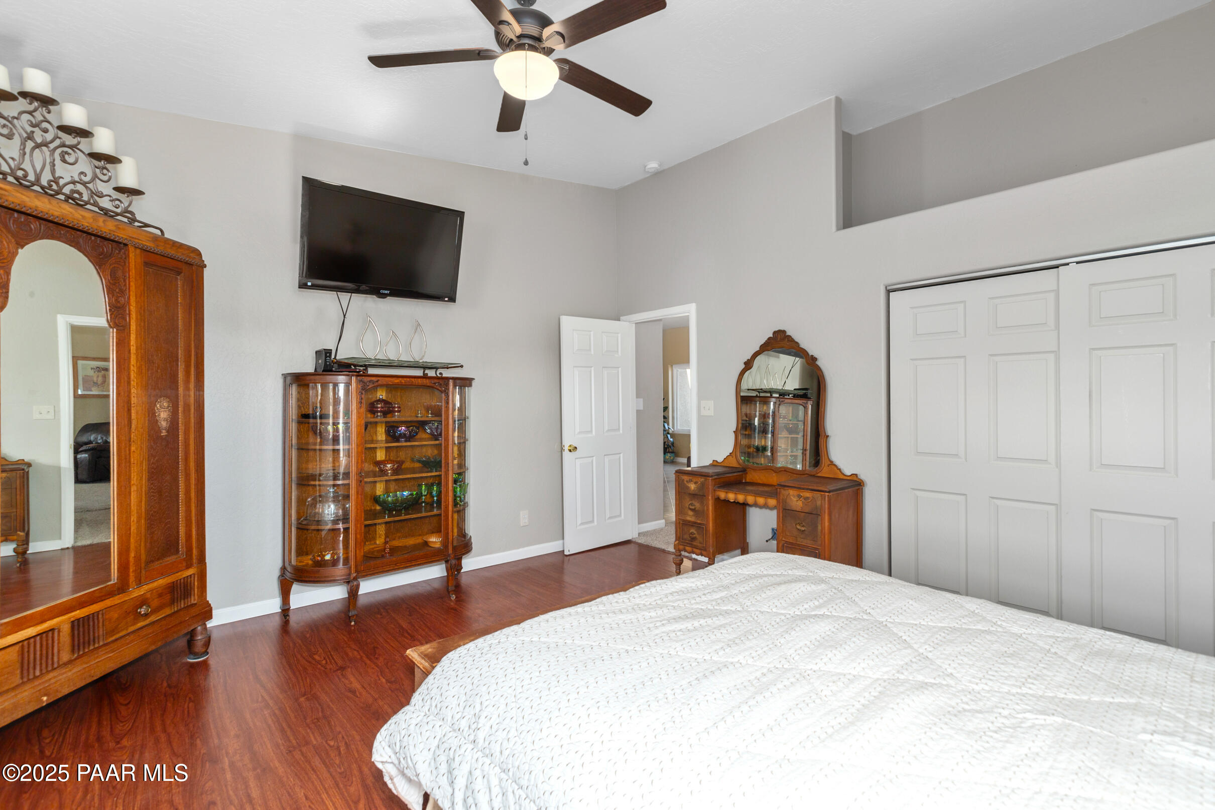 1780 South Yellow Brick Road Chino Valley, AZ 86323 - Photo 29 of 47 a bedroom with a bed and wooden floor