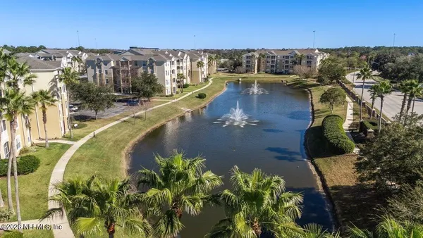 a view of a swimming pool with a yard