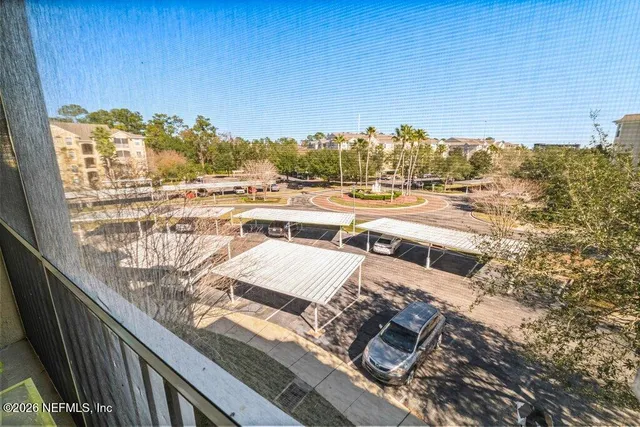a view of swimming pool with outdoor seating and plants