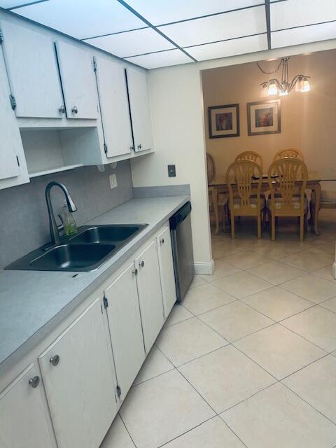 951 De Soto Road, Unit 233 Boca Raton, FL 33432 - Photo 12 of 41 a kitchen with a sink and cabinets