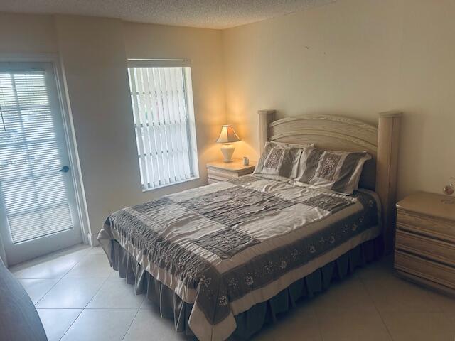 951 De Soto Road, Unit 233 Boca Raton, FL 33432 - Photo 18 of 41 a bedroom with a bed and window