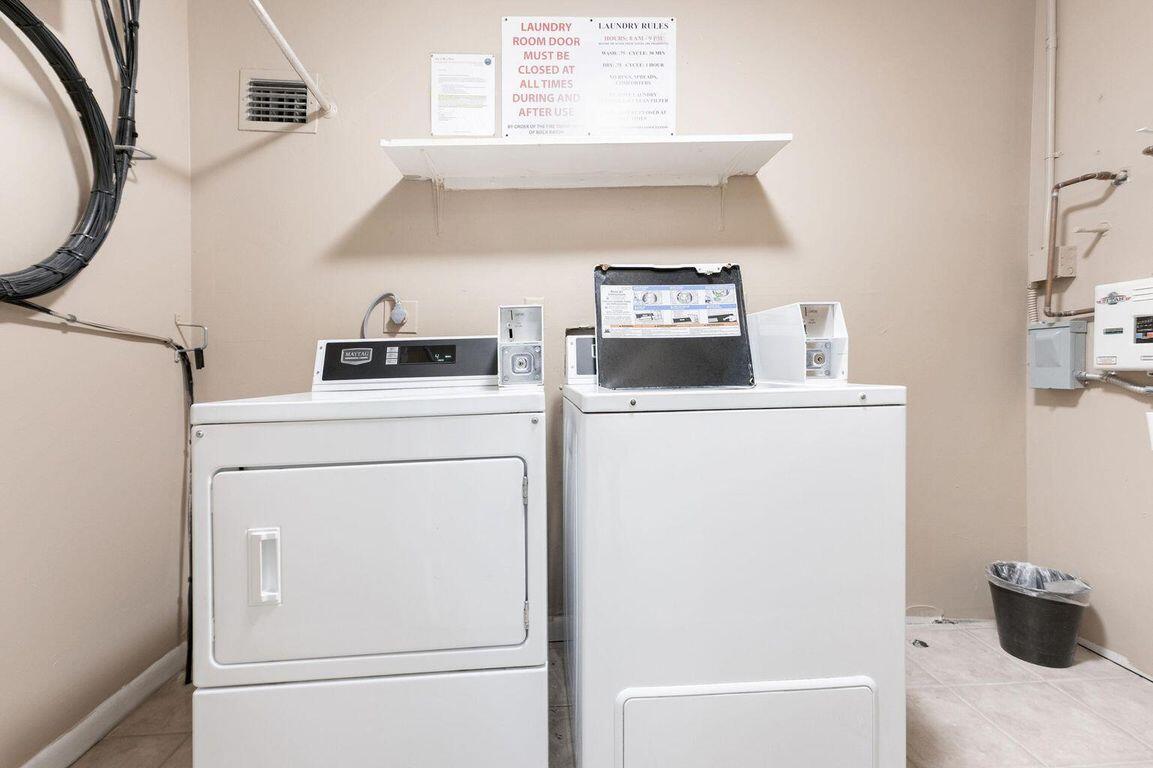 951 De Soto Road, Unit 233 Boca Raton, FL 33432 - Photo 34 of 41 a utility room with dryer and washer