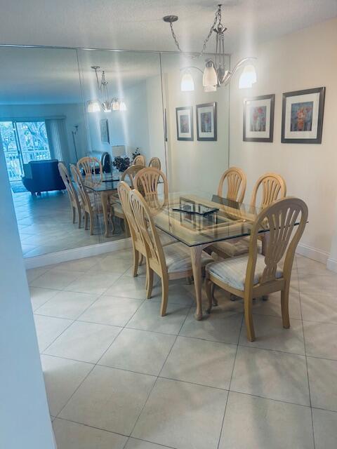 951 De Soto Road, Unit 233 Boca Raton, FL 33432 - Photo 8 of 41 a view of a dining room with furniture