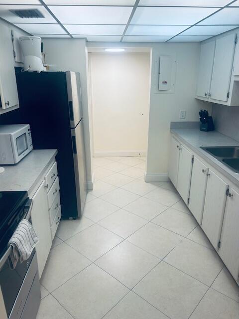 951 De Soto Road, Unit 233 Boca Raton, FL 33432 - Photo 10 of 41 a utility room with cabinets washer and dryer