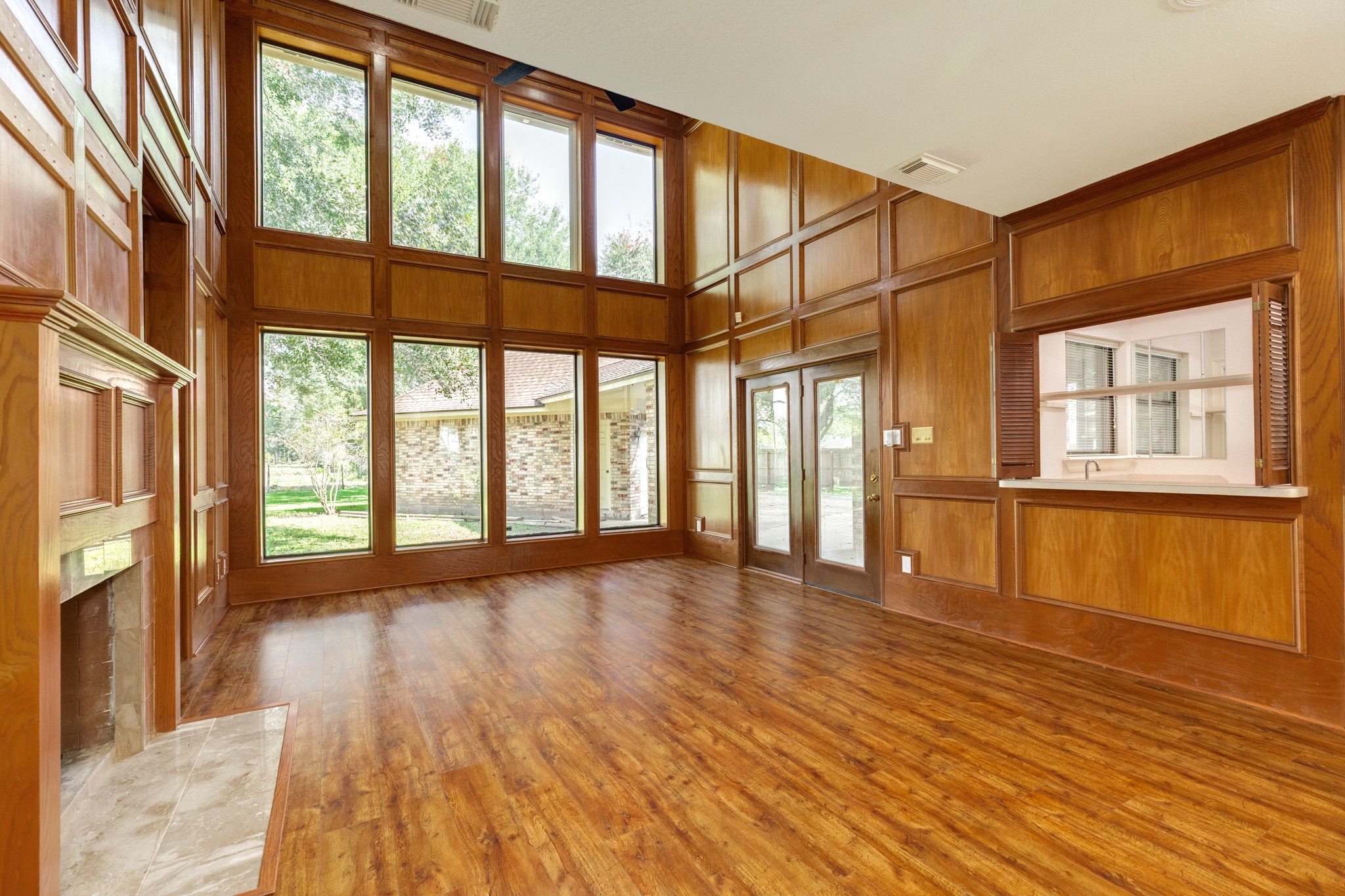 1600 Azalea Street Sweeny, TX 77480 - Photo 16 of 42 a view of an empty room with wooden floor and a window