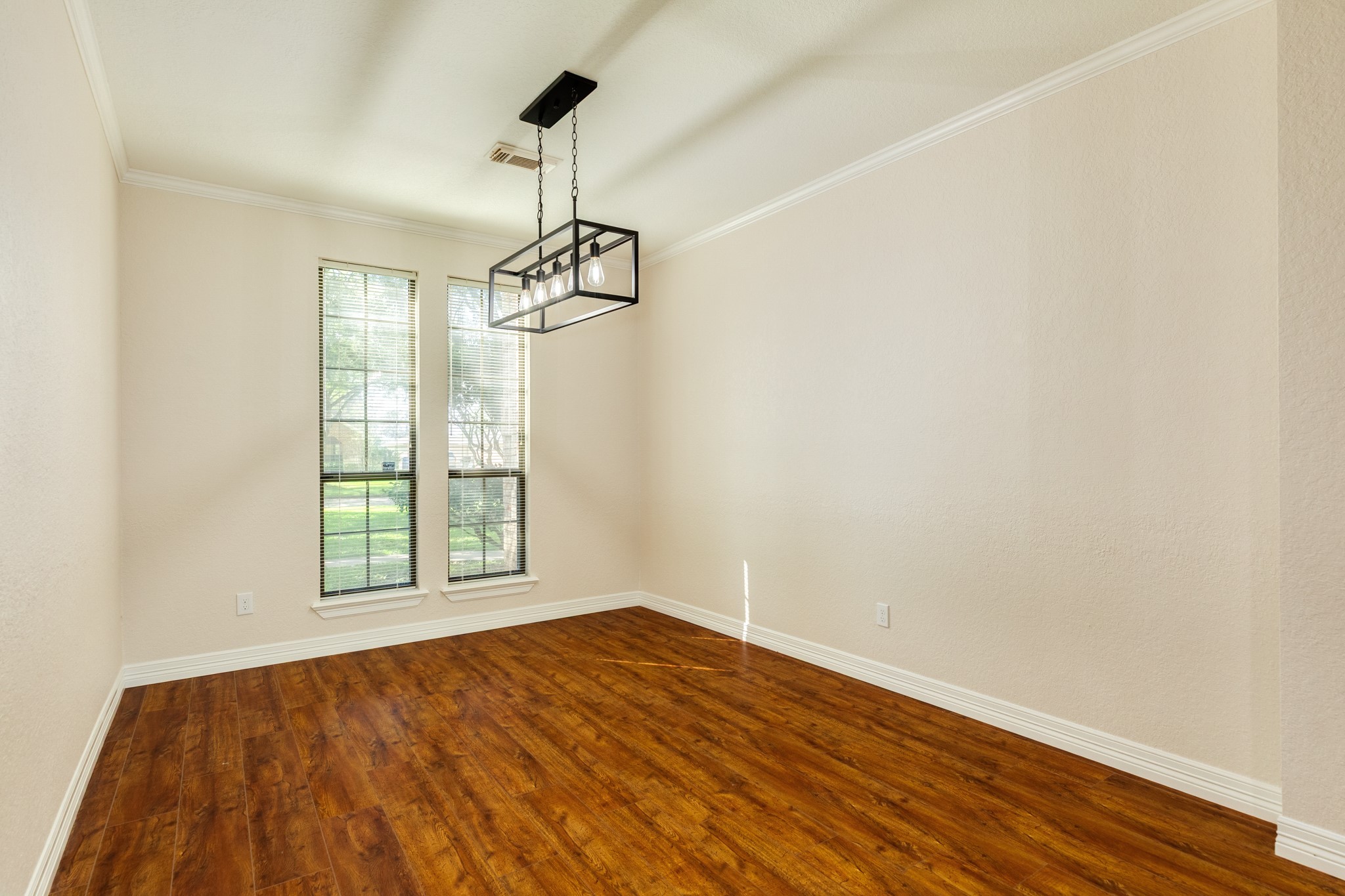 1600 Azalea Street Sweeny, TX 77480 - Photo 20 of 42 a view of empty room with wooden floor and windows
