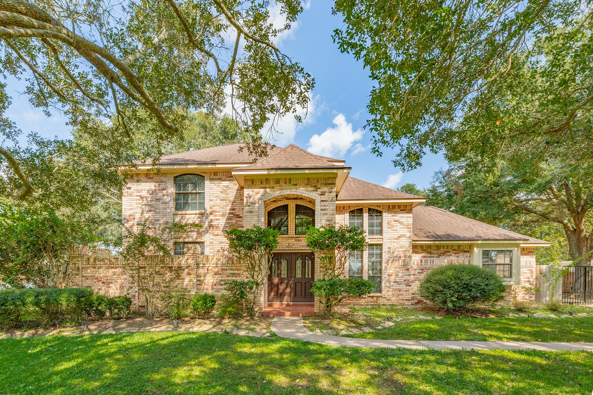 1600 Azalea Street Sweeny, TX 77480 - Photo 2 of 42 front view of a house with a yard