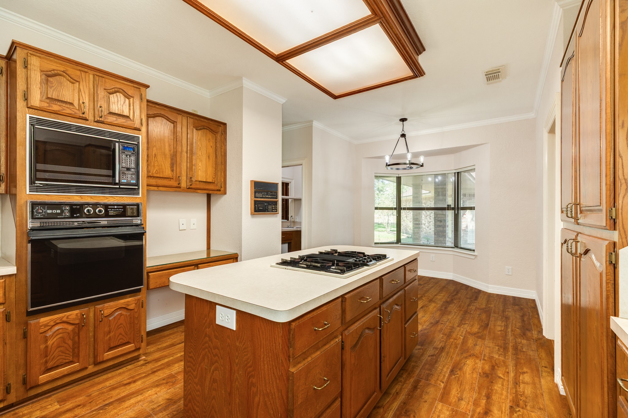 1600 Azalea Street Sweeny, TX 77480 - Photo 22 of 42 a kitchen that has a stove and a microwave