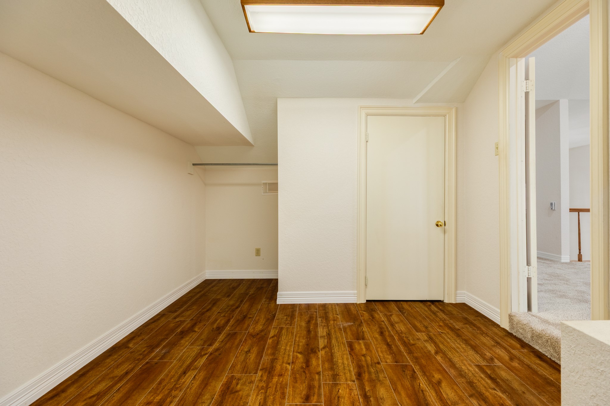 1600 Azalea Street Sweeny, TX 77480 - Photo 33 of 42 a view of empty room with wooden floor and fan