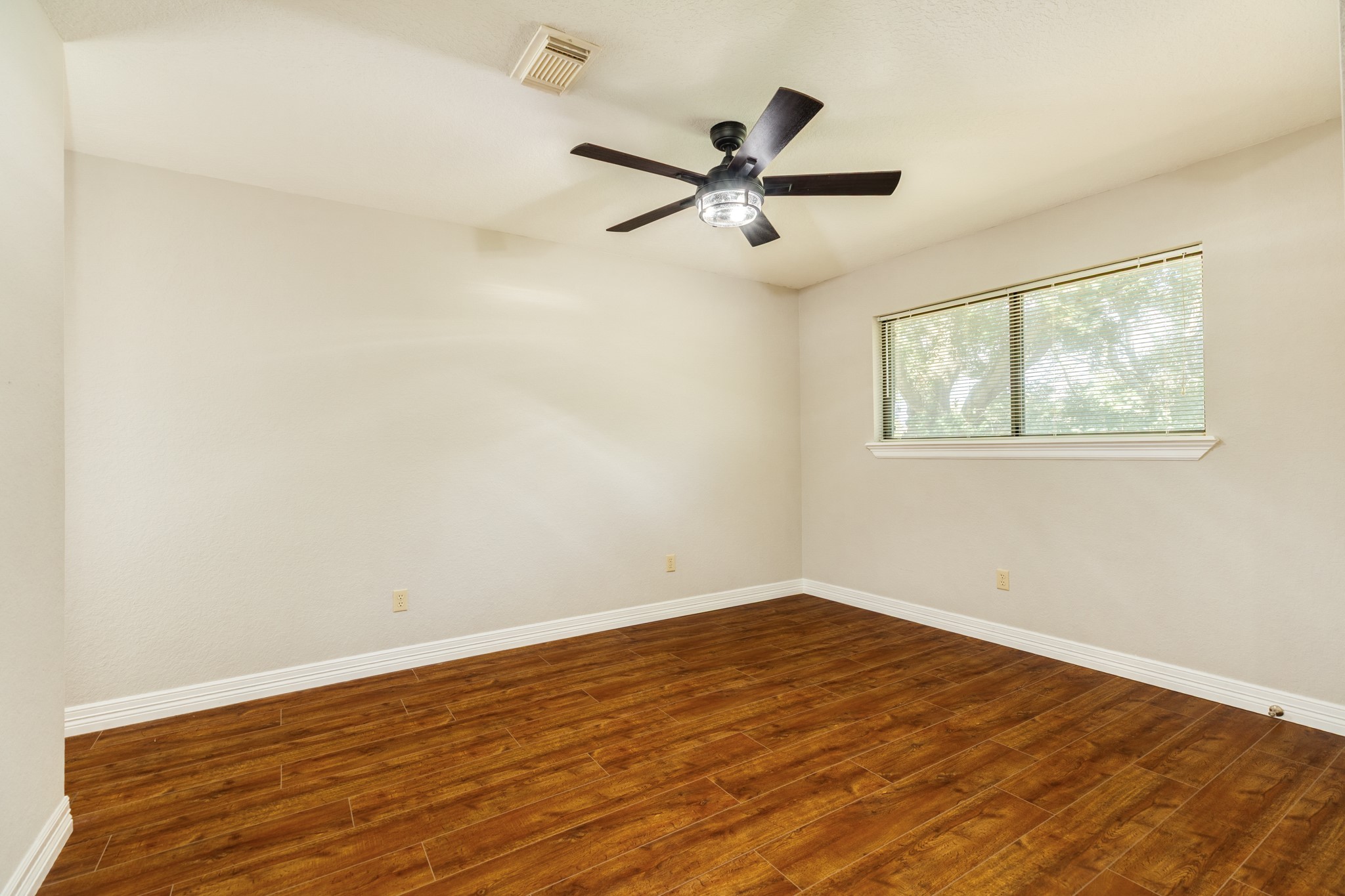1600 Azalea Street Sweeny, TX 77480 - Photo 35 of 42 wooden floor in an empty room with a window