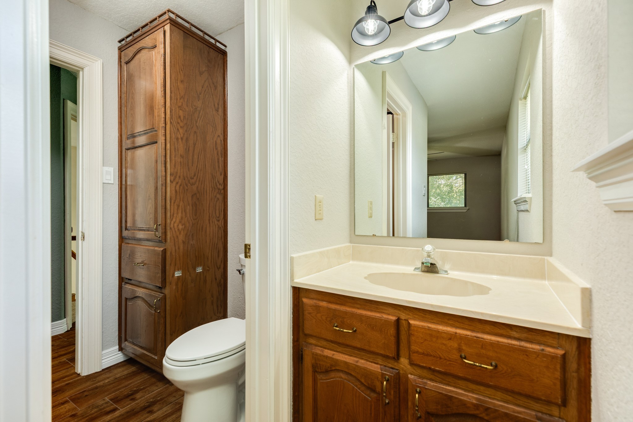 1600 Azalea Street Sweeny, TX 77480 - Photo 36 of 42 a bathroom with a sink a toilet and shower