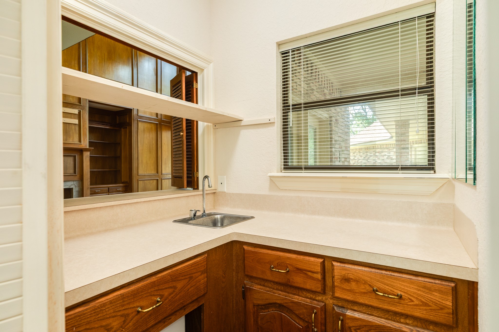 1600 Azalea Street Sweeny, TX 77480 - Photo 42 of 42 a bathroom with a sink and a large mirror next to a window