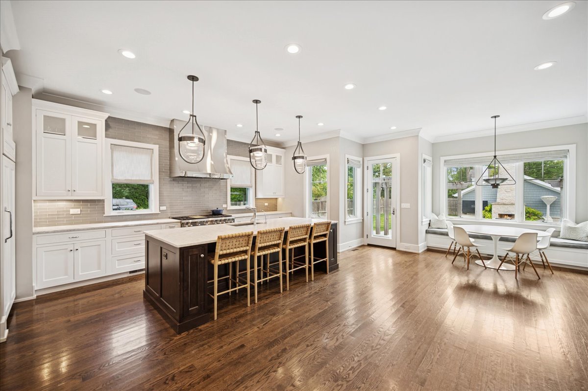 1004 Oak Street Winnetka, IL 60093 - Photo 12 of 51 a large kitchen with lots of counter space a sink and appliances