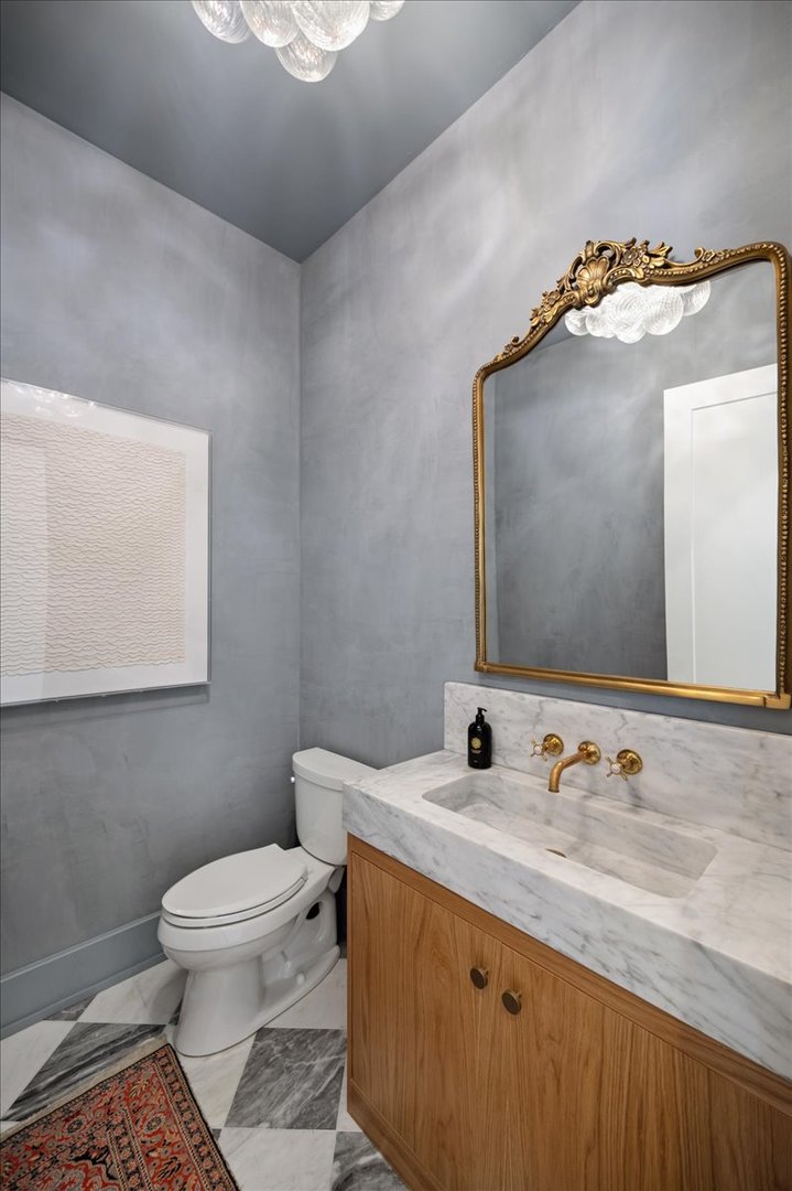1004 Oak Street Winnetka, IL 60093 - Photo 23 of 51 a bathroom with a granite countertop sink and a mirror