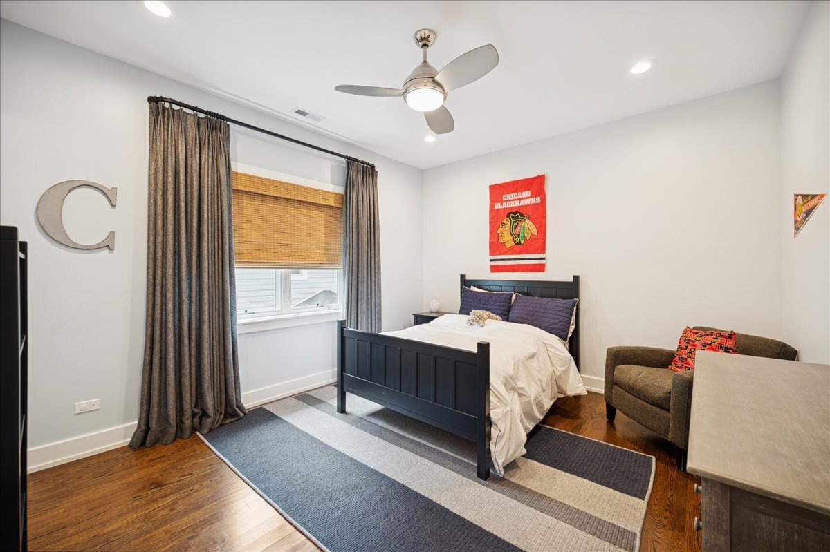 1004 Oak Street Winnetka, IL 60093 - Photo 30 of 51 a bed room with a bed and a window