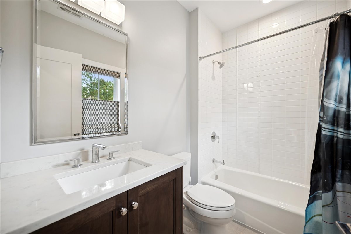 1004 Oak Street Winnetka, IL 60093 - Photo 31 of 51 a bathroom with a granite countertop sink toilet and shower