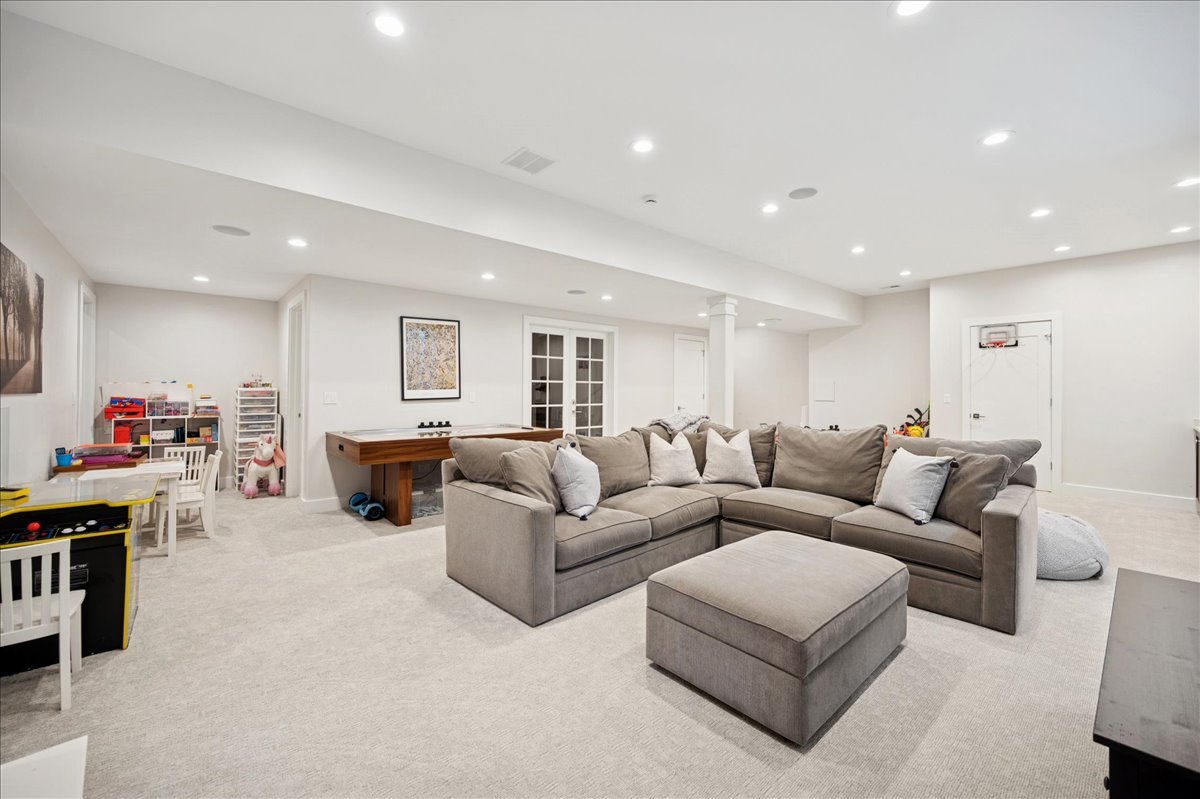 1004 Oak Street Winnetka, IL 60093 - Photo 38 of 51 a living room with furniture and a flat screen tv