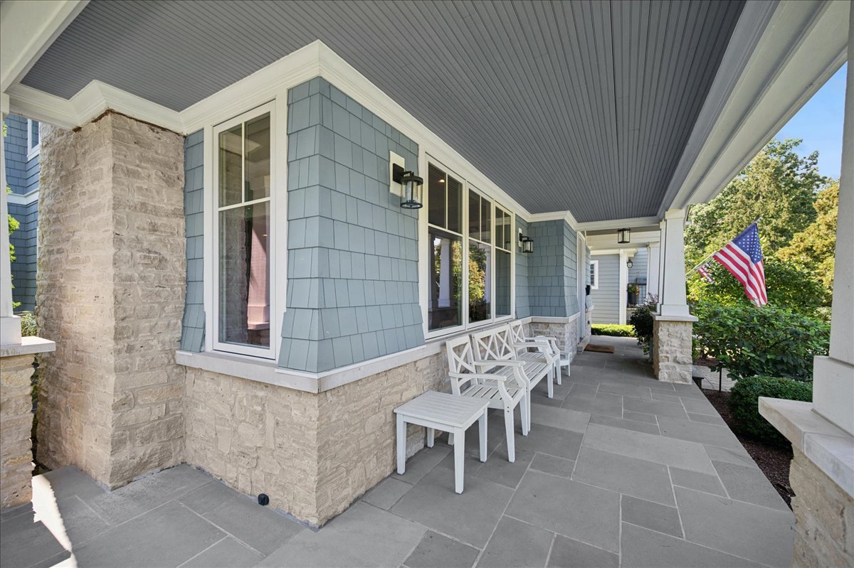 1004 Oak Street Winnetka, IL 60093 - Photo 4 of 51 a view of a patio with table and chairs and potted plants