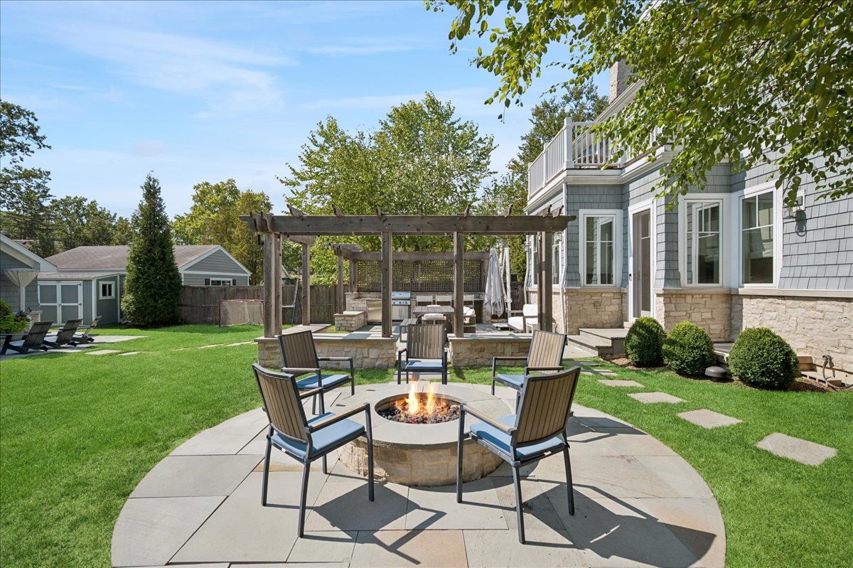 1004 Oak Street Winnetka, IL 60093 - Photo 44 of 51 a view of a patio with a table and chairs