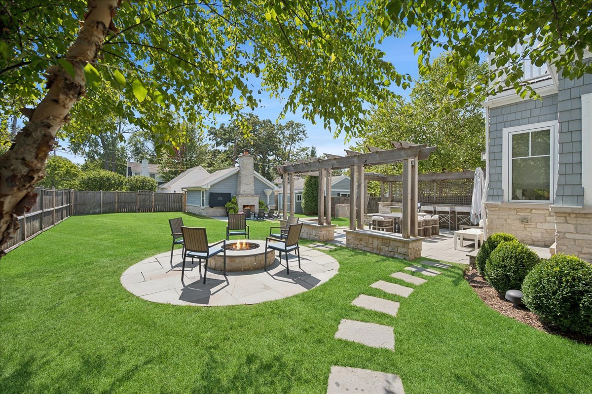 1004 Oak Street Winnetka, IL 60093 - Photo 45 of 51 a view of a house with a backyard and a patio