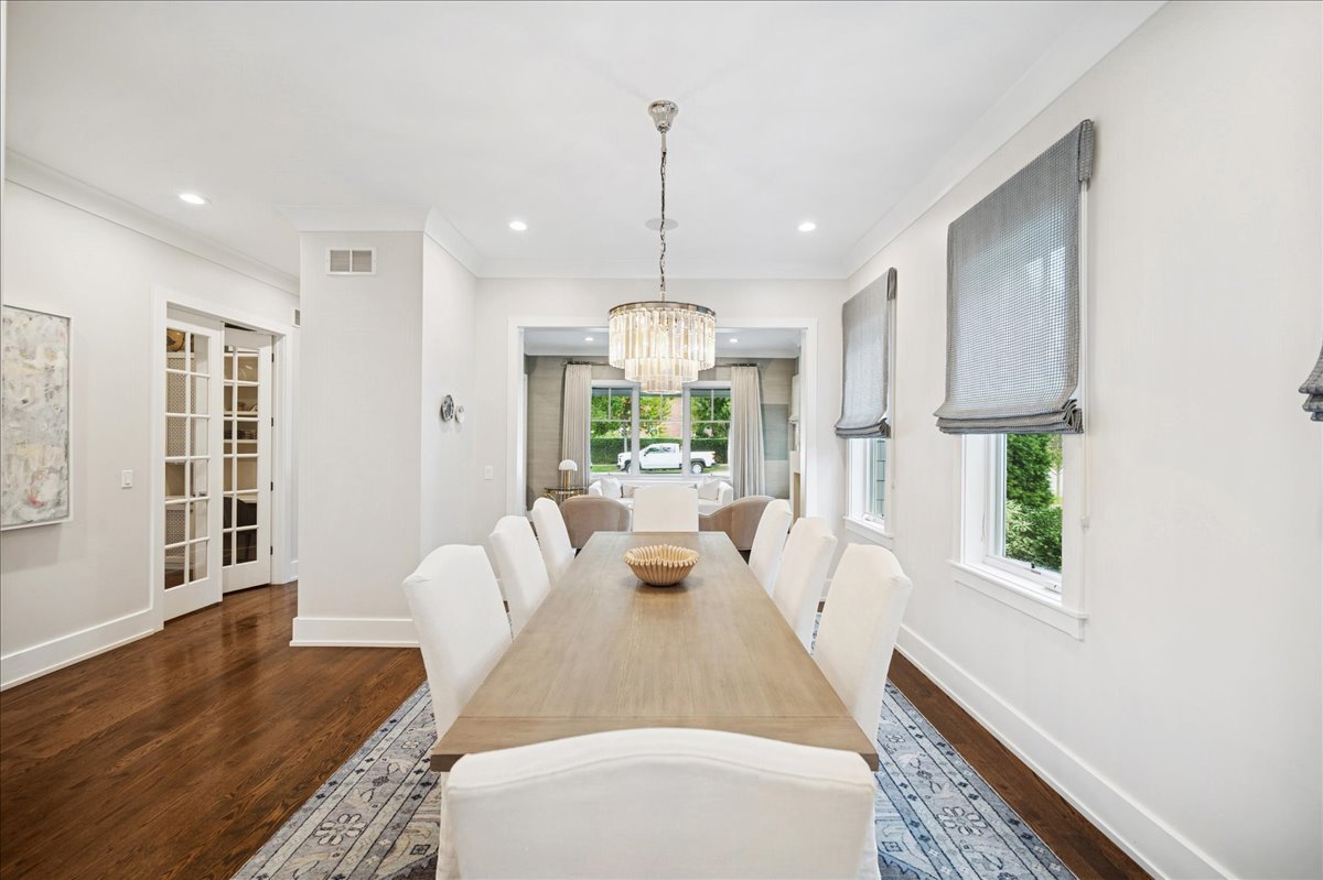 1004 Oak Street Winnetka, IL 60093 - Photo 10 of 51 a view of a living room and kitchen with wooden floor