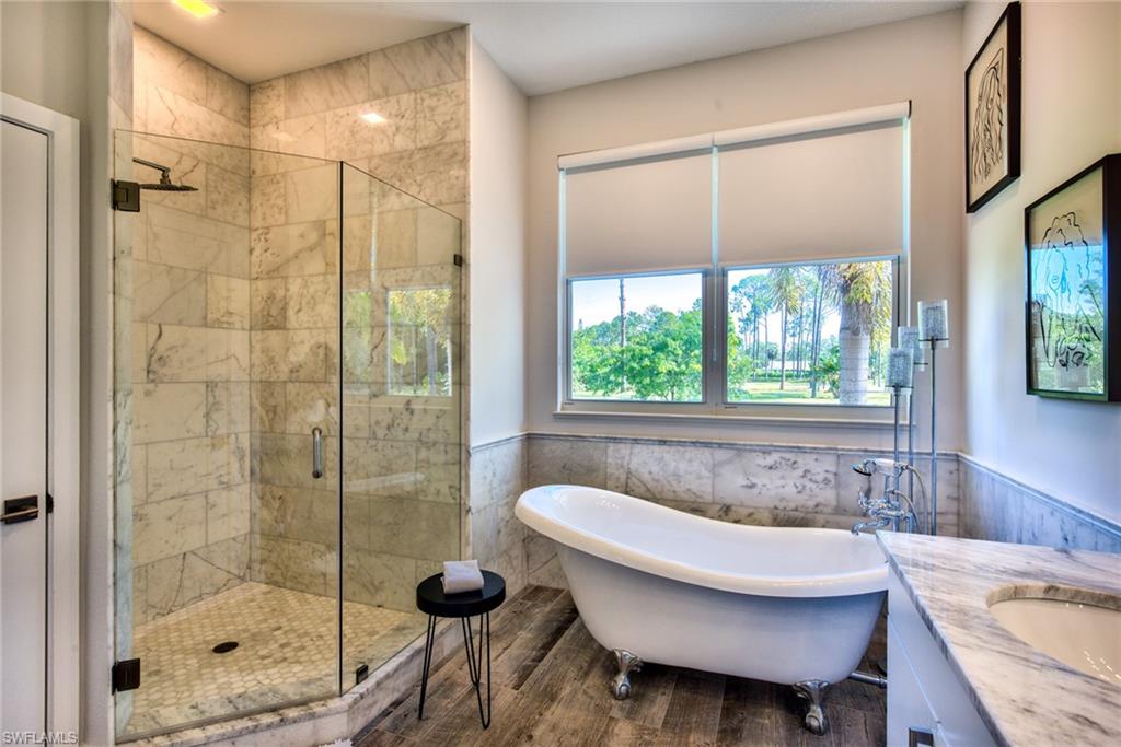 6106 Copper Leaf Lane Naples, FL 34116 - Photo 15 of 35 a bathroom with a sink toilet and shower