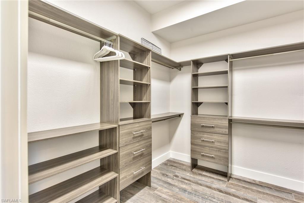 6106 Copper Leaf Lane Naples, FL 34116 - Photo 17 of 35 a view of walk in closet with empty racks