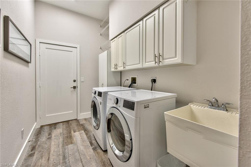 6106 Copper Leaf Lane Naples, FL 34116 - Photo 22 of 35 a utility room with dryer and washer