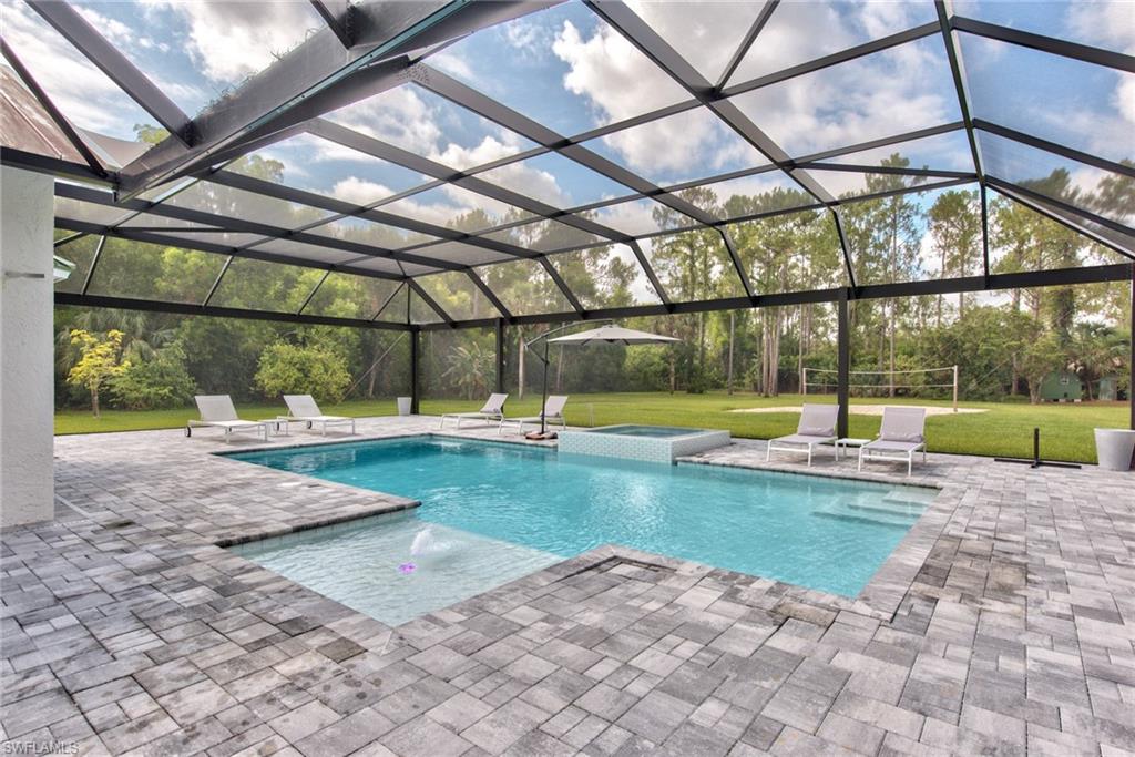 6106 Copper Leaf Lane Naples, FL 34116 - Photo 30 of 35 a view of swimming pool with a yard