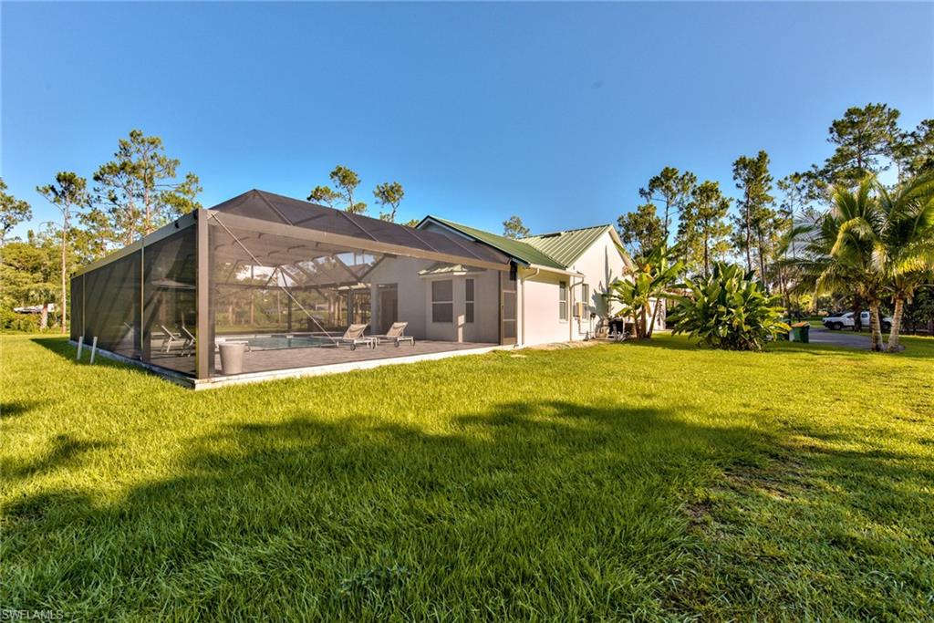 6106 Copper Leaf Lane Naples, FL 34116 - Photo 35 of 35 a front view of house with yard