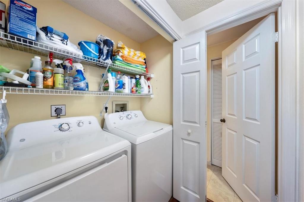 760 Willowbrook Drive, Unit 1204 Naples, FL 34108 - Photo 19 of 25 a utility room with dryer and washer