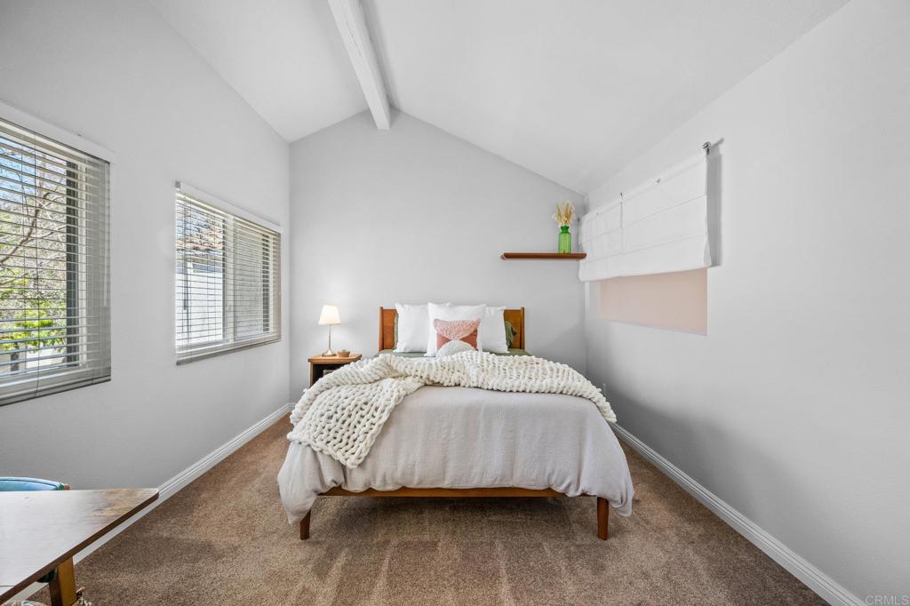 1935 Sunset Drive, Unit 96 Escondido, CA 92025 - Photo 16 of 24 a bedroom with a bed and window