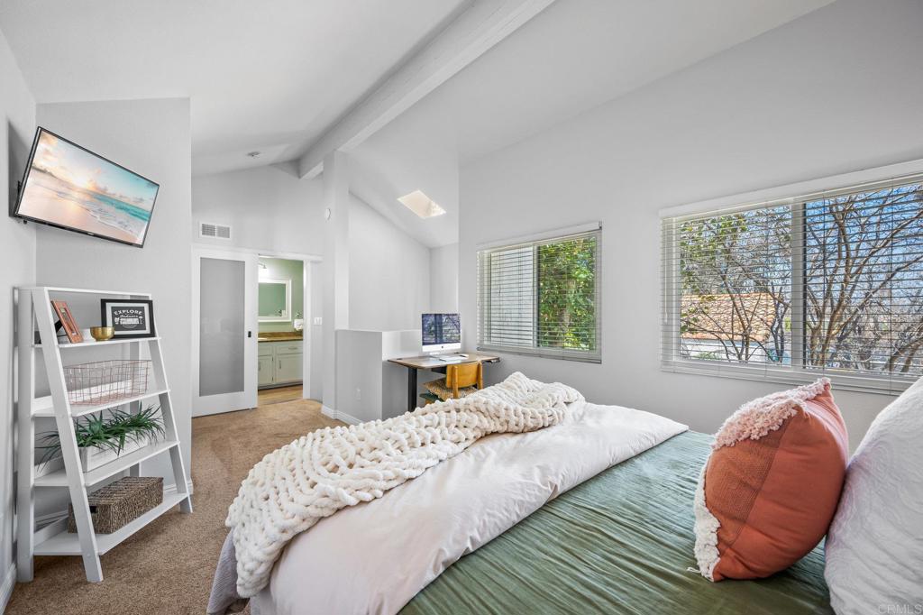 1935 Sunset Drive, Unit 96 Escondido, CA 92025 - Photo 17 of 24 a bedroom with a bed and wooden floor