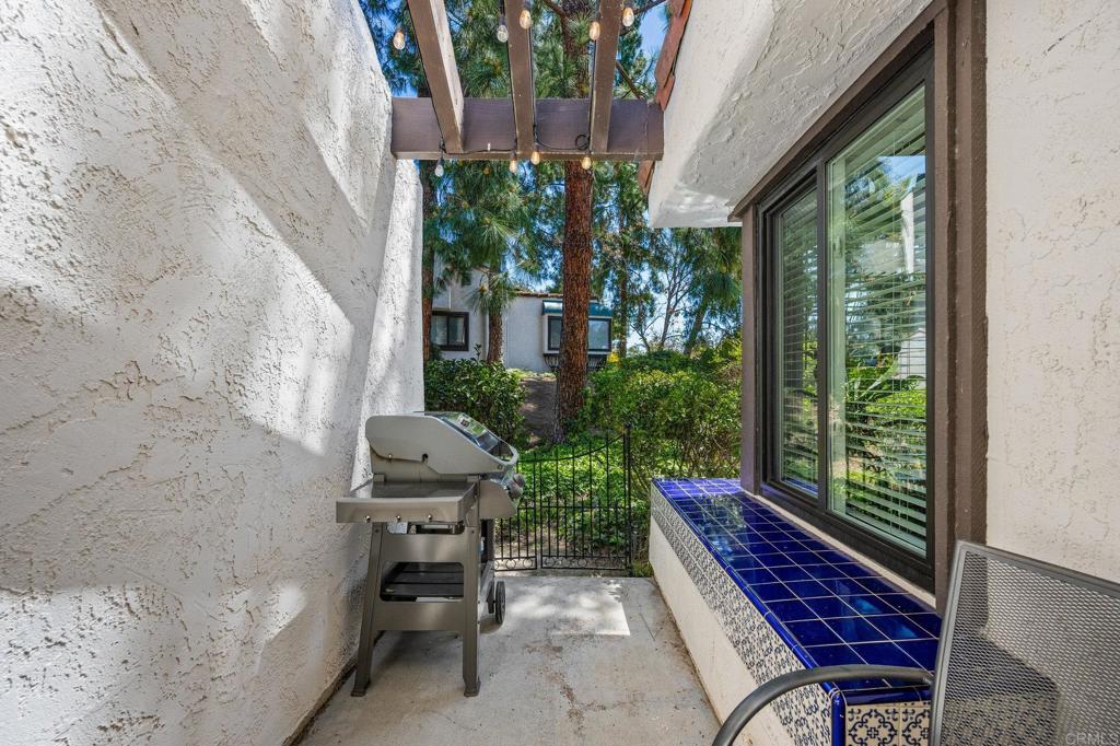 1935 Sunset Drive, Unit 96 Escondido, CA 92025 - Photo 20 of 24 a view of a balcony with chairs and a potted plant