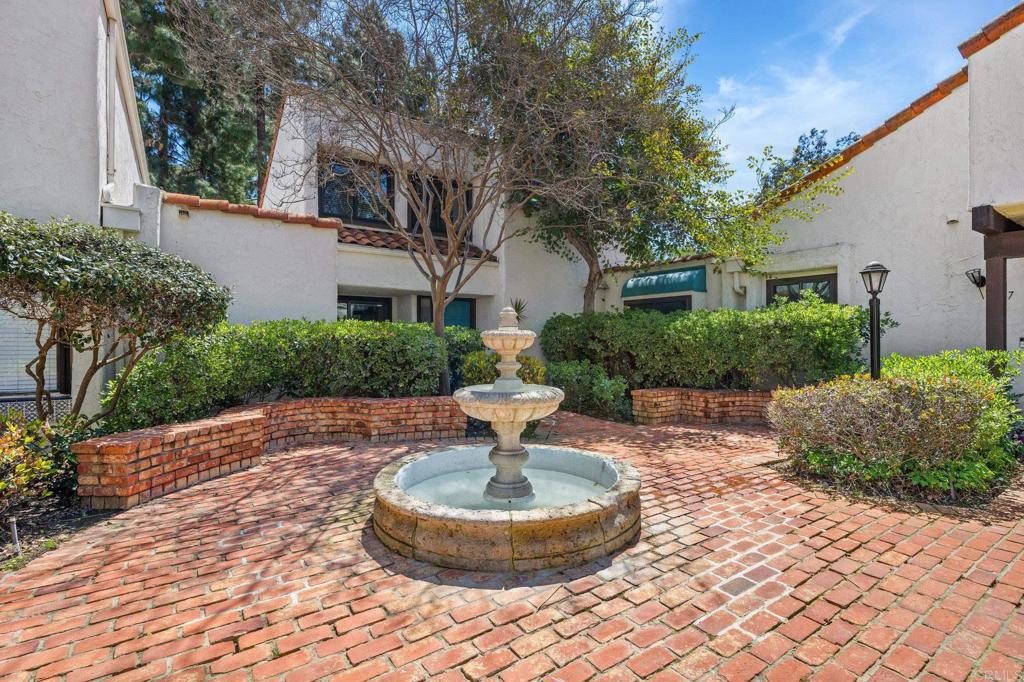 1935 Sunset Drive, Unit 96 Escondido, CA 92025 - Photo 23 of 24 a front view of a house with a yard