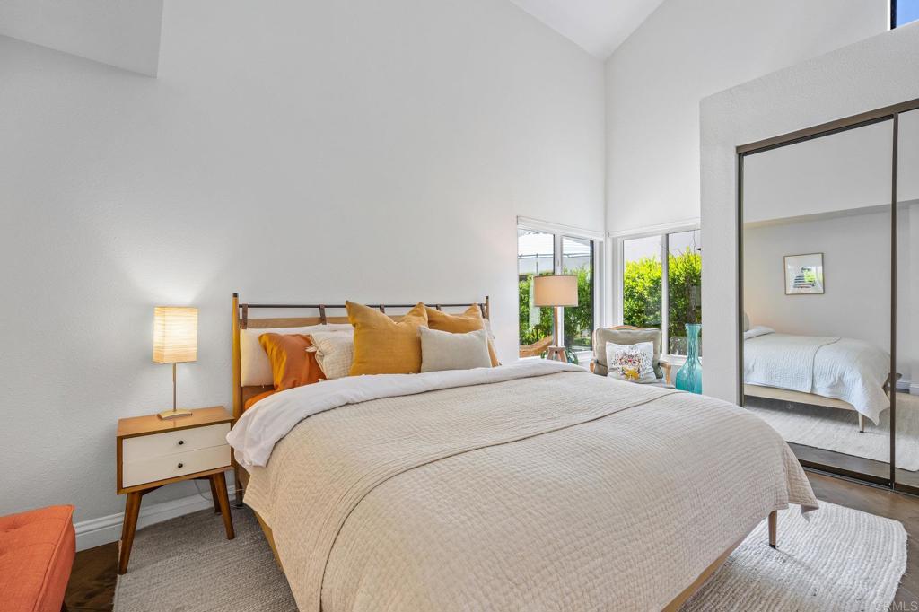 1935 Sunset Drive, Unit 96 Escondido, CA 92025 - Photo 9 of 24 a bedroom with a bed and a large window