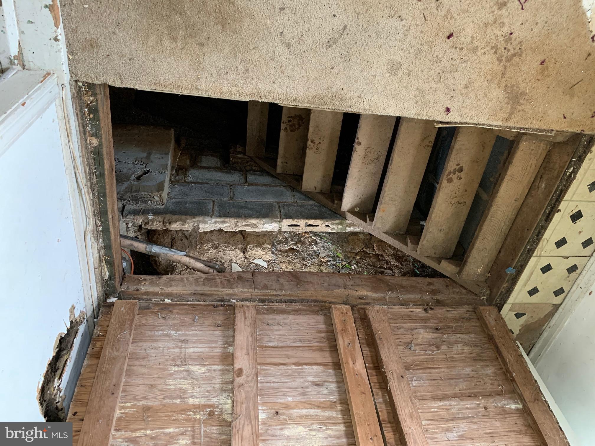 8999 Wellington Road Manassas, VA 20109 - Photo 14 of 20 Stairs to 5' crawl space from porch